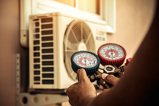 Professional Heat Pump Repair technician working in Pleasant Lake, MI